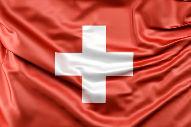 en Suisse